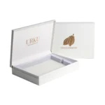 White rigid box with embossed logo