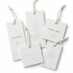 Black and beige paper hang tags with foil print