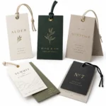 Embossed clothing tag with metal eyelet