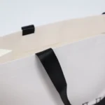 White beauty shopping bag with ribbon handles