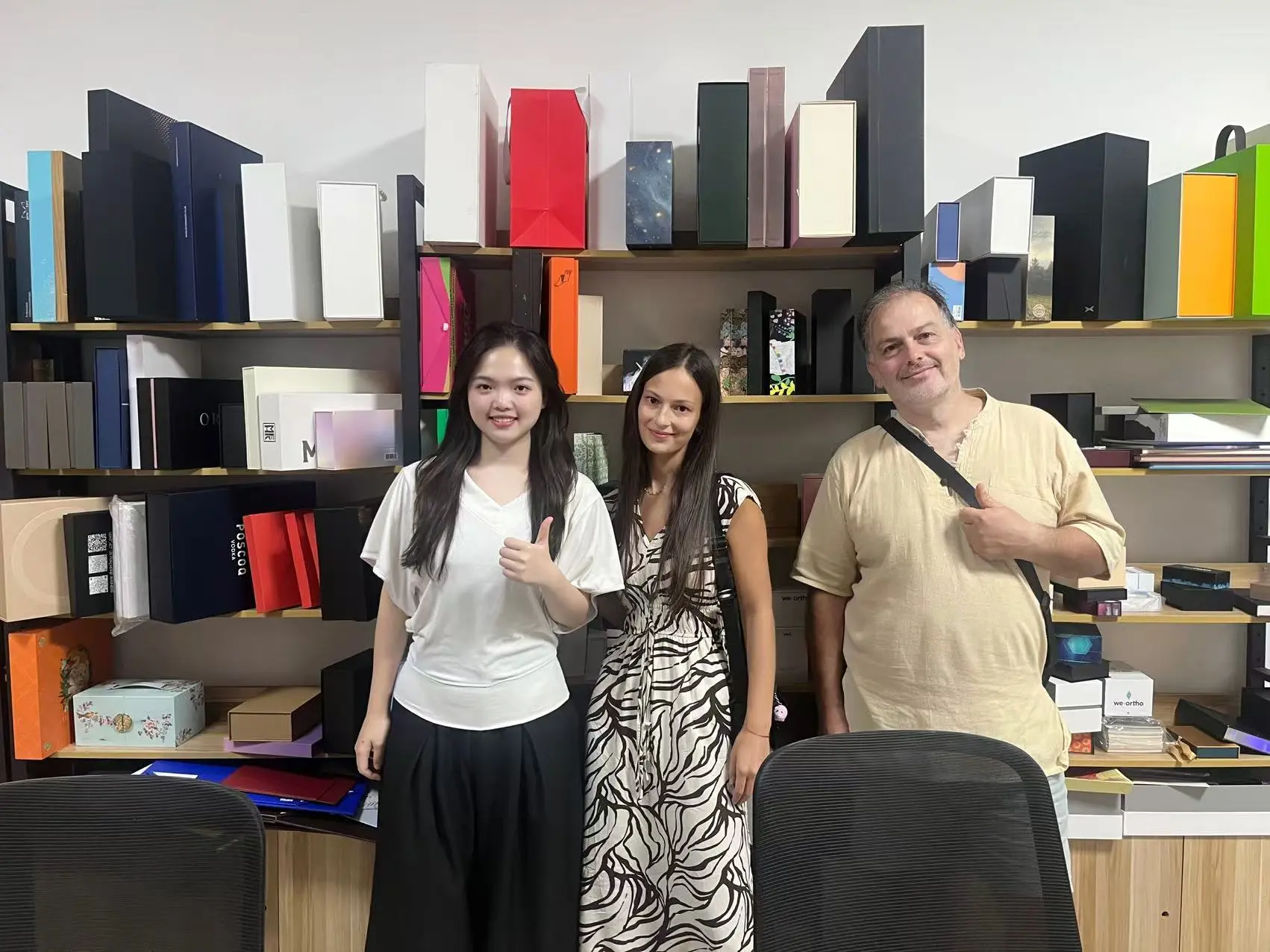 Customers with the One Plus One Packaging team in the showroom